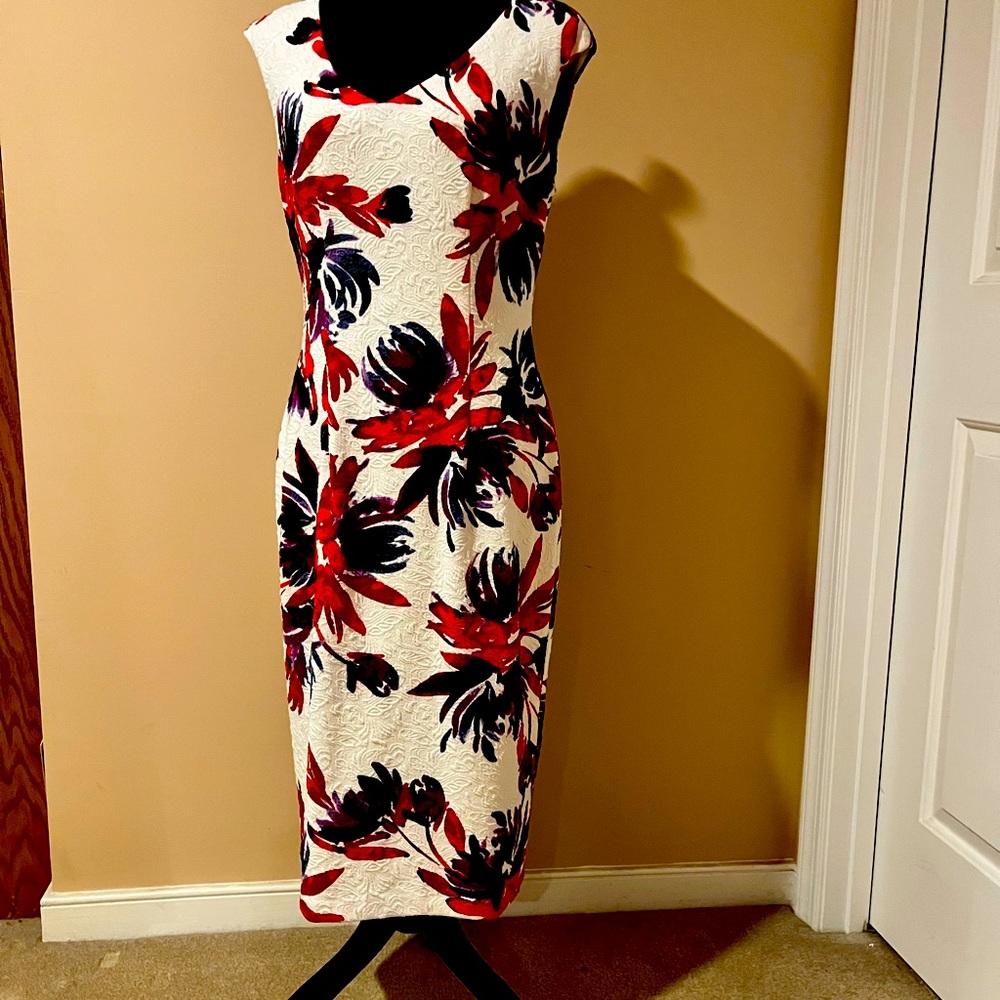 Cap sleeve Maggy London colorful over white background.